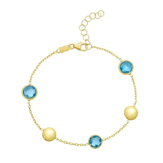 Bracelet chaîne en or jaune 14k avec pastilles et topazes bleues