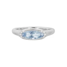 14 Karat white gold ladies' ring set with an oval-shaped Aquamarine and 0.05 carats of diamonds