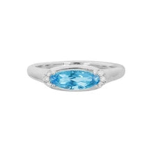14 Karat white gold ladies' ring set with an oval-shaped Aquamarine and 0.05 carats of diamonds