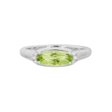 14 Karat white gold ladies' ring set with an oval-shaped Aquamarine and 0.05 carats of diamonds
