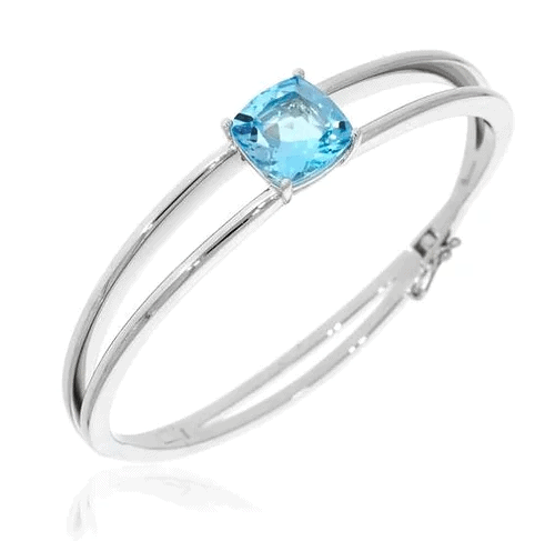 Rhodium-finished 925 silver bangle bracelet set with a blue topaz